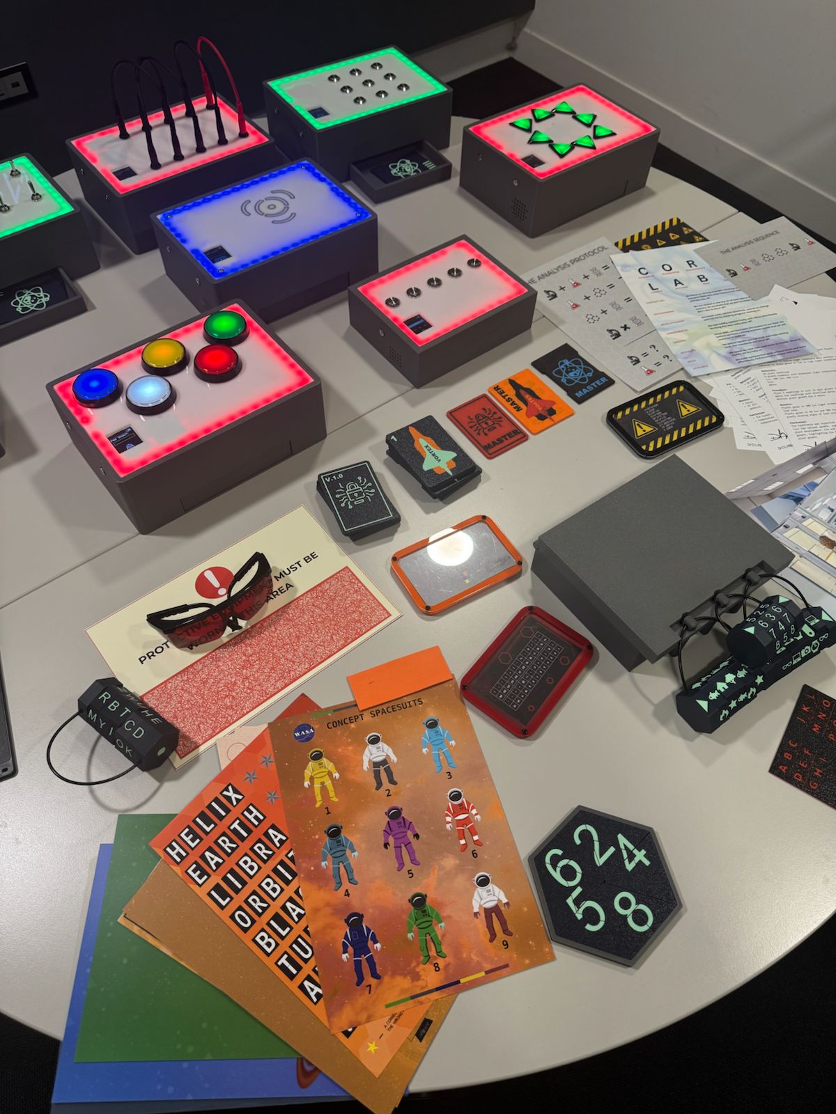 UNPACK electronic modules and printed materials laid out on a table
