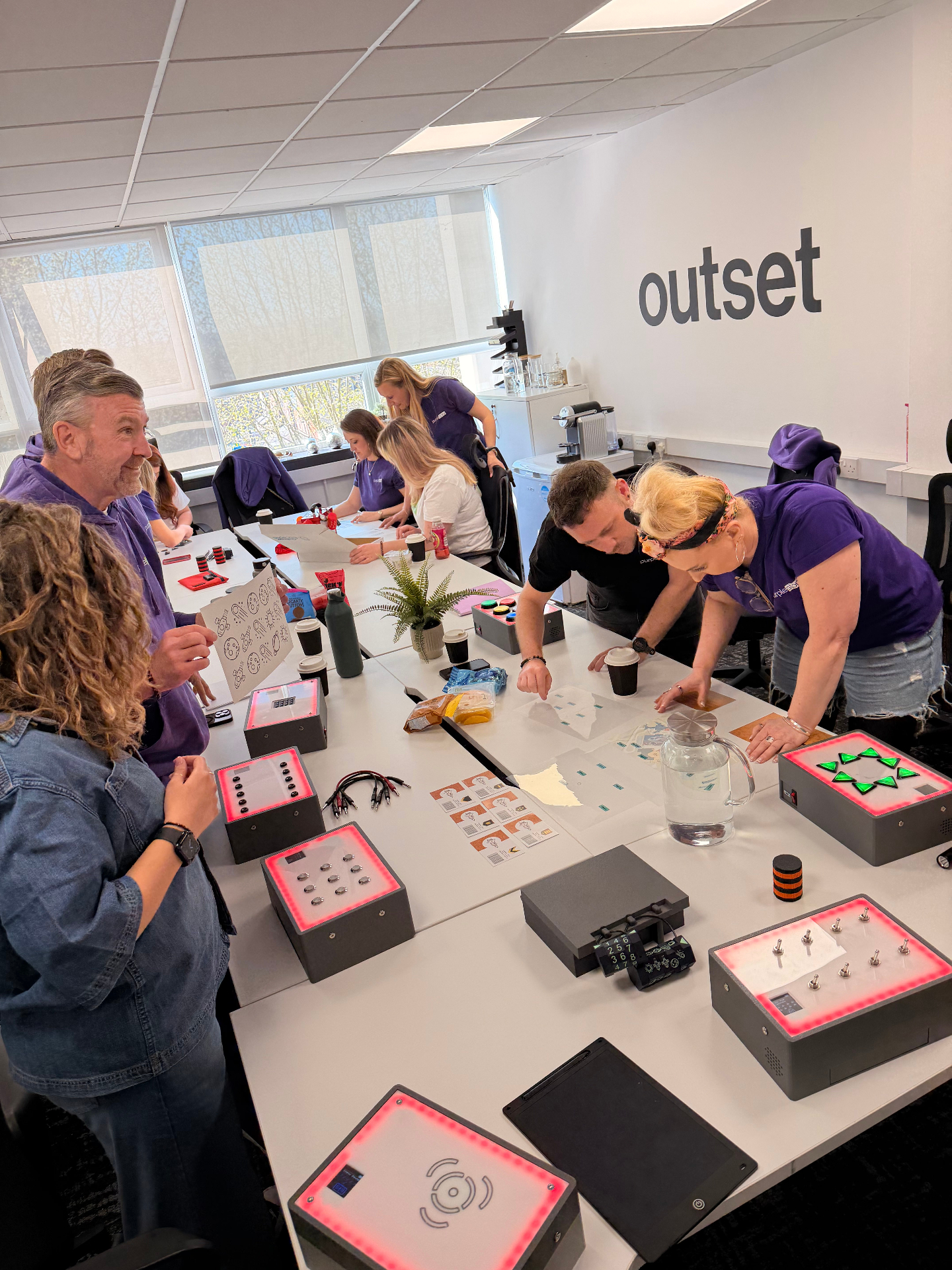 Participants collaborating on UNPACK modules in an office
